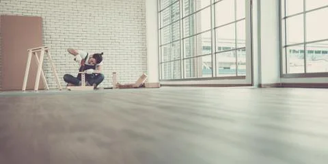 Handyman is assembling table. Stock Photos