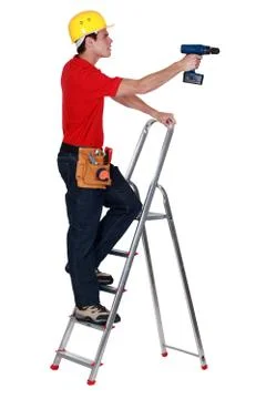 A handyman with a drill. Stock Photos