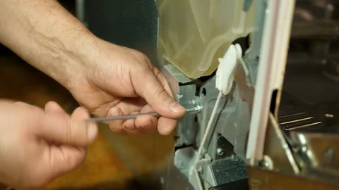 Handyman fixing broken dishwasher machine with a screwdriver. Close-up Isolated. Stock-Footage 123604253