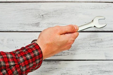 Handyman holding wrench in hand Foto stock