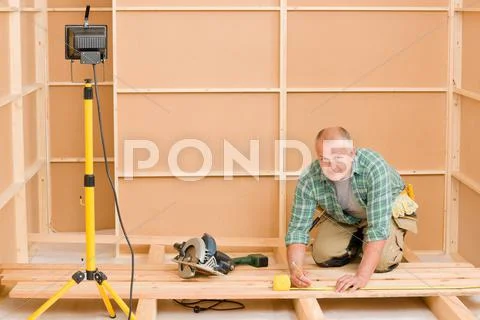 Handyman home improvement wooden floor renovation Stock Photos