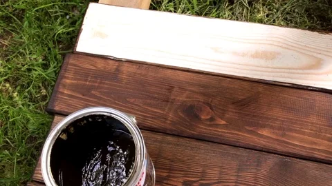 Handyman paints the batten Stock Footage 76143370