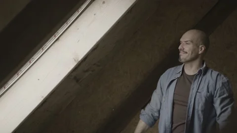 Handyman putting insolation in a wall Stock Footage 149291941