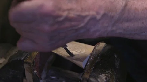 Handyman shaping wood with chisel in workshop Stock Footage 79822291
