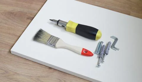 Handyman tools and hardware prepared for domestic furniture installation. Rep Stock Photos