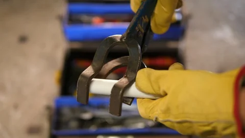 Handymen use Pipe holder metalic tool device. Worker fixing toolbox. Stock Footage 126329366