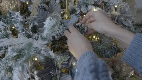Hang Christmas Decorations on the Tree Stock Footage 295600898