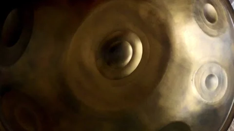 Hang drum playing overhead roll shot Stock Footage 270747301