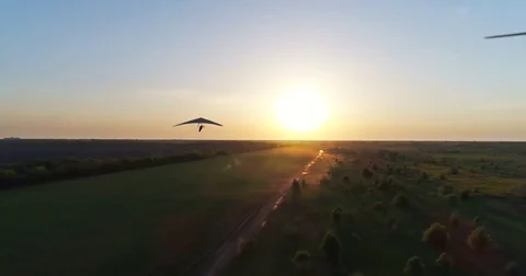 Hang glider flight in sunset time Stock Footage 83749168