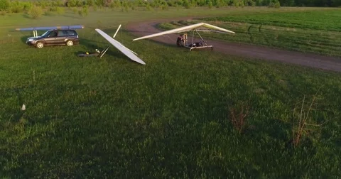 Hang glider flight in sunset time Stock Footage 83749416
