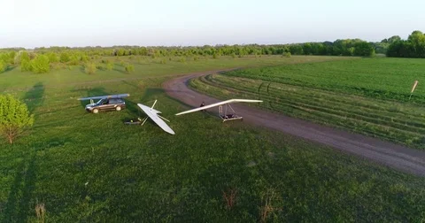 Hang glider flight in sunset time Stock Footage 83750013