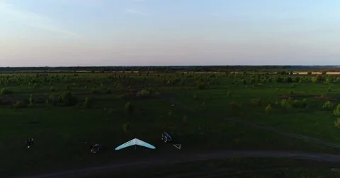 Hang glider flight in sunset time Stock Footage 83750414