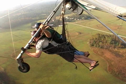 Hang Glider Floats Through the Clouds Tandem Hang Gliding Aerial  Stock Footage 145355