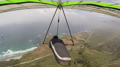 Hang Glider fly near clouds over ocean beaches Stock-Footage 76694946