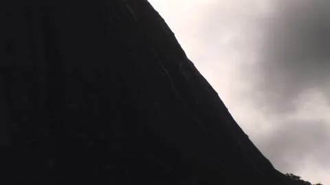 Hang-glider flying close to the mountain - September 15th, 2010 Stock Footage 314065696