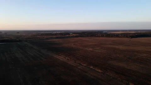 Hang glider flying on the field at sunset, shooting from a drone Stock Footage 211364708