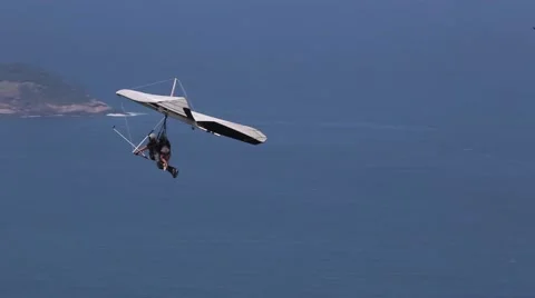 Hang glider flying over the ocean Stock Footage 50759437