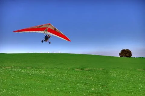 Hang glider on green Stock Photos