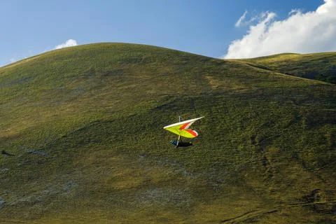 Hang glider just after launch from Monte Cucco Regional Park, Umbria, Italy Stock Photos