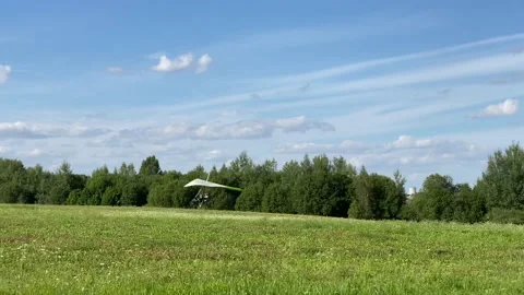 Hang glider landing in the field Stock Footage 136524593