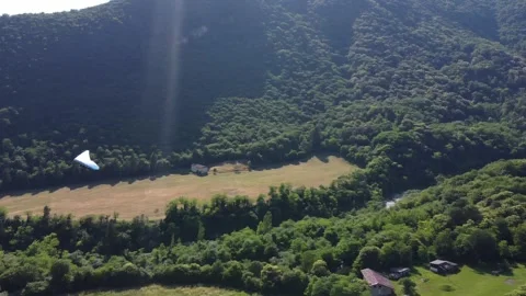 Hang glider landing Stock Footage 285953876