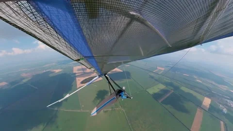 Hang glider soars under the clouds on high altitude Stock Footage 157552320