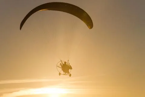 Hang glider at sunset Stock Photos