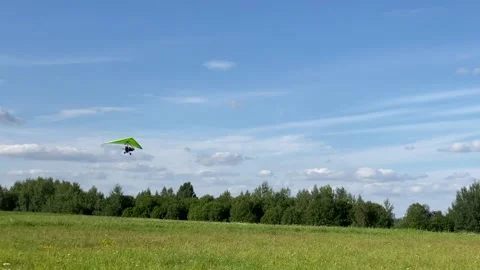 Hang glider taking off and going up in the sky Stock Footage 136524601
