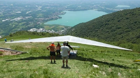 Hang glider taking off from Cornizzolo Mountain Stock Footage 135601301
