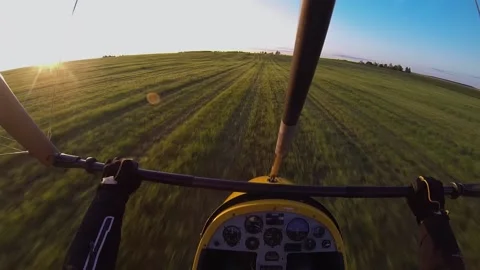 The hang glider is taking off over the field Stock Footage 197405934
