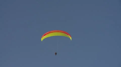 Hang gliders flying the sky Stock Footage 64220852