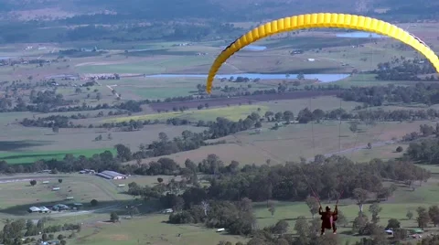 Hang gliders take off from a mountain top Stock Footage 41854236