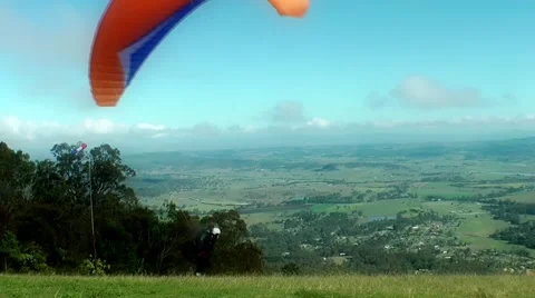 Hang gliders take off from a mountain top Stock Footage 41854312