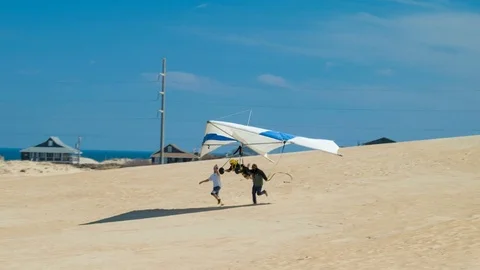 Hang Gliding School Flying on Sand Dune at Jockeys Ridge in Outer Banks NC Stock-Footage 73027277