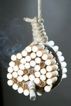 Hang himself with cigarettes Stock Photos