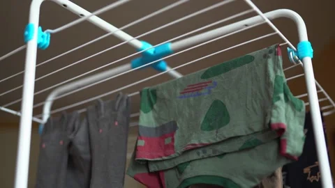 Hang laundry on the dryer. Using a clothes dryer. Bottom view Stock Footage 267025463