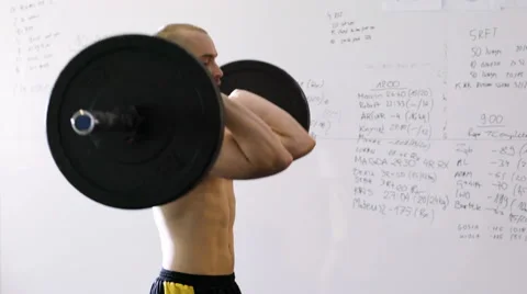 Hang power clean exercise - young man doing weight lifting workout at gym Stock Footage 65279991
