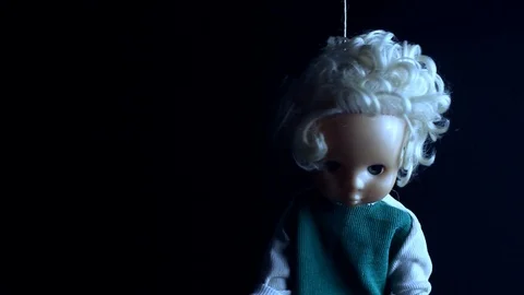 Hanged doll on black background. Stock Footage 89558338