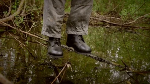 Hanged man over the swamp, camera move around Stock Footage 77485810