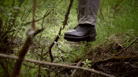 Hanged man over the swamp, camera move from left to right Stock Footage 77485998