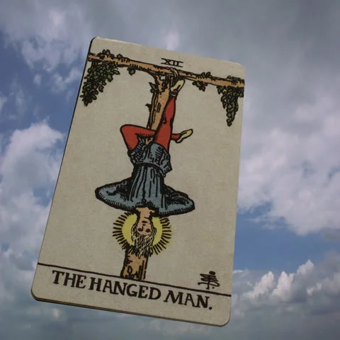 The Hanged Man tarot card dangles, suspe | Stock Video