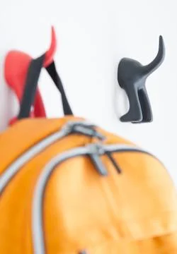 Hanger with bagpack Stock Photos