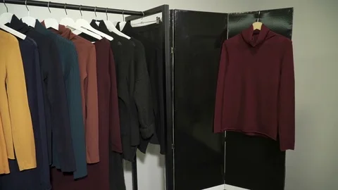 Hangers with clothes in the boutique Stock Footage 72134083