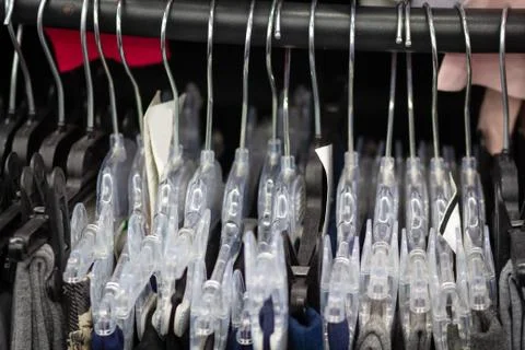 Hangers with clothes close-up Stock Photos