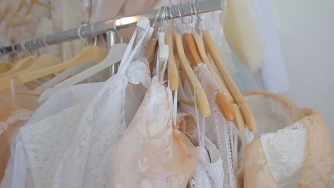 Hangers with clothes in the store Stock Footage 115079669