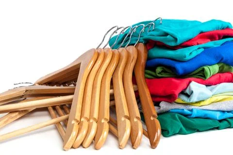 Hangers with clothes on a white background. Stock Photos