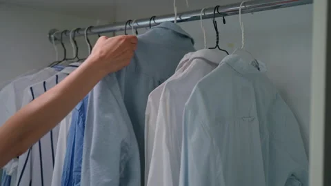 Hangers with different shirts Stock Footage 229701262