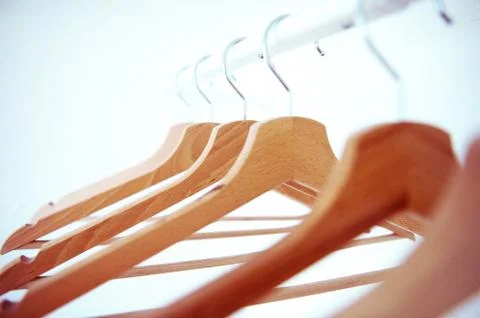 Hangers on the rack placed sort of chaotically Stock Photos