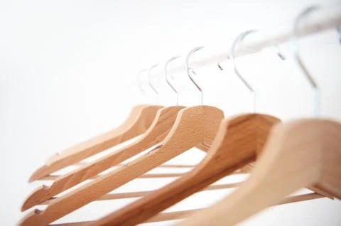 Hangers on the rack placed sort of chaotically Stock Photos