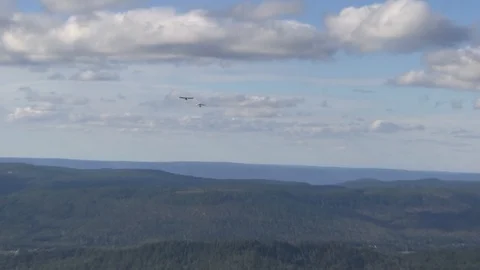 Hangglider being pulled by motorized aircraft. Stock Footage 96460054